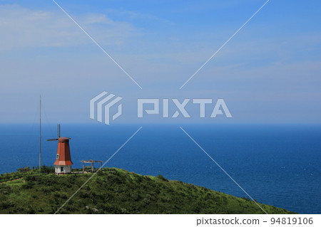 Munakata Oshima Windmill Observatory and beautiful blue Genkai Sea scenery in autumn Munakata Oshima Windmill Observatory and beautiful blue Genkai Sea scenery in autumn 94819106