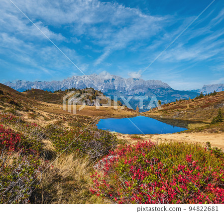 Autumn alpine Kleiner Paarsee or Paarseen lake, Land Salzburg, Austria. Alps Hochkonig rocky mountain group view in far. Autumn alpine Kleiner Paarsee or Paarseen lake, Land Salzburg, Austria. Alps Hochkonig rocky mountain group view in far. 94822681