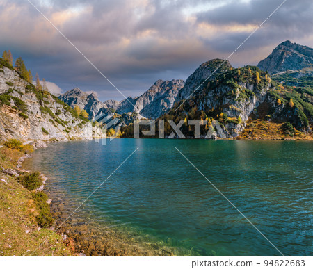 Sunny autumn alpine Tappenkarsee lake and rocky mountains above, Kleinarl, Land Salzburg, Austria. Sunny autumn alpine Tappenkarsee lake and rocky mountains above, Kleinarl, Land Salzburg, Austria. 94822683