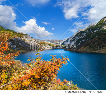 Sunny autumn alpine Tappenkarsee lake and rocky mountains above, Kleinarl, Land Salzburg, Austria. Sunny autumn alpine Tappenkarsee lake and rocky mountains above, Kleinarl, Land Salzburg, Austria. 94822686