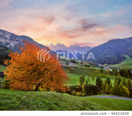 Autumn daybreak Santa Magdalena famous Italy Dolomites village view in front of the Geisler or Odle Dolomites mountain rocks. Picturesque traveling and countryside beauty concept background. 94822688