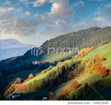 Autumn sunrise Santa Magdalena famous Italy Dolomites mountain village environs view in first sunlight. Picturesque traveling, seasonal and countryside beauty concept background. Autumn sunrise Santa Magdalena famous Italy Dolomites mountain village environs view in first sunlight. Picturesque traveling, seasonal and countryside beauty concept background. 94822689