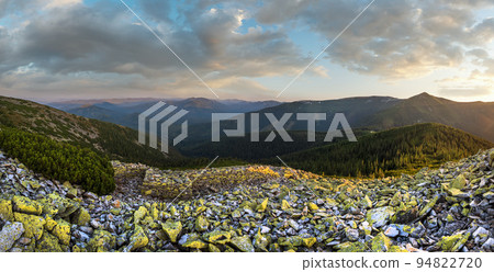 Summer evening Carpathian mountain stony slope panoramic view in last sunset sunlight. Vysoka Mountain, Gorgany Carpathian massive, Ukraine. Summer evening Carpathian mountain stony slope panoramic view in last sunset sunlight. Vysoka Mountain, Gorgany Carpathian massive, Ukraine. 94822720