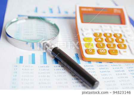 Magnifying glass on charts graphs paper. Financial development, Banking Account, Statistics, Investment Analytic research data economy. Magnifying glass on charts graphs paper. Financial development, Banking Account, Statistics, Investment Analytic research data economy. 94823146
