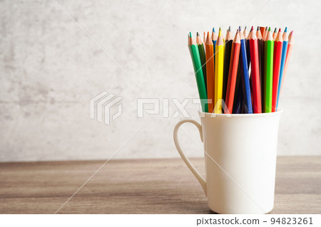 Colorful pencils in glass jar with copy space, learning university education concept. Colorful pencils in glass jar with copy space, learning university education concept. 94823261