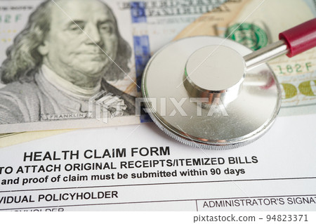 Health claim form with stethoscope and US dollar banknotes, insurance accident medical concept. Health claim form with stethoscope and US dollar banknotes, insurance accident medical concept. 94823371