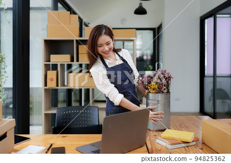 Asian SME business woman working at home office. online shopping concept Asian SME business woman working at home office. online shopping concept 94825362