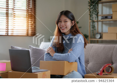 Asian SME business woman working at home office. online shopping concept Asian SME business woman working at home office. online shopping concept 94825364