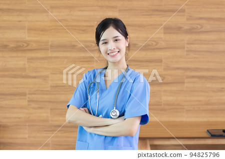 portrait Young beautiful asian successful female doctor or nurse with stethoscope portrait Young beautiful asian successful female doctor or nurse with stethoscope 94825796