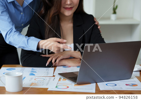 Business People Meeting to discuss and brainstorming the financial report paperwork in home office. Financial advisor teamwork and accounting concept Business People Meeting to discuss and brainstorming the financial report paperwork in home office. Financial advisor teamwork and accounting concept 94826158