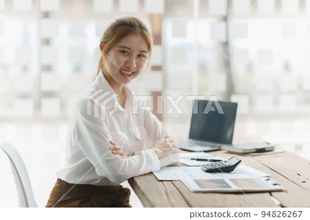Beautiful young asian business woman at office Beautiful young asian business woman at office 94826267