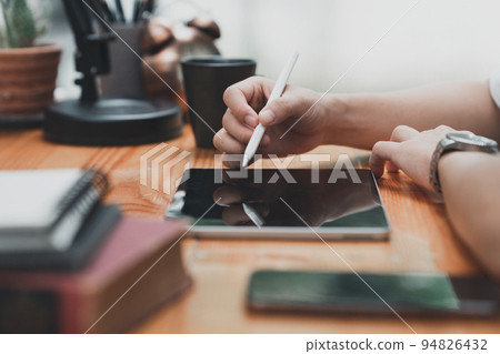 Graphic designer drawing in digital tablet at home. Creative concept Graphic designer drawing in digital tablet at home. Creative concept 94826432