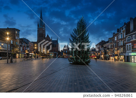 Jette, Brussels Capital Region - Belgium -  The local market square, Place Miroir with a colorful sunset during the christmas holidays 94826861