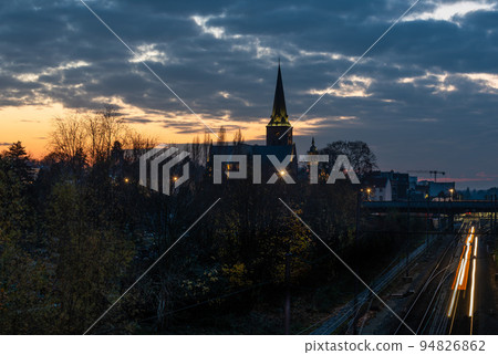Jette, Brussels Capital Region, Belgium, View over the railway tracks, the cemetery and the church by night Jette, Brussels Capital Region, Belgium, View over the railway tracks, the cemetery and the church by night 94826862