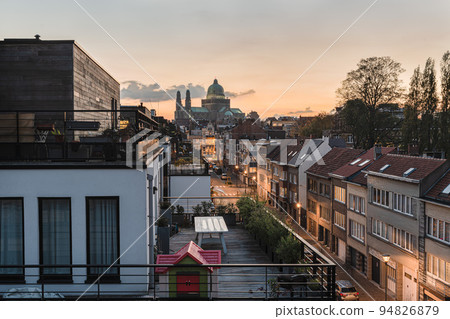 Jette, Brussels Capital Region - Belgium - Landscape view over the city apartments and houses with the Basilica of the Sacred Heart in the background 94826879