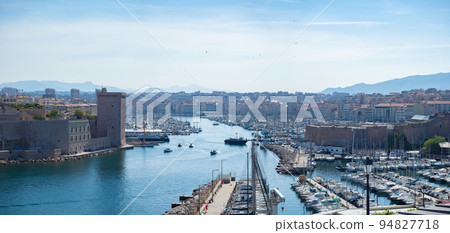 Marseille, France - May 15th 2022: Entrance towards the historic harbour Marseille, France - May 15th 2022: Entrance towards the historic harbour 94827718