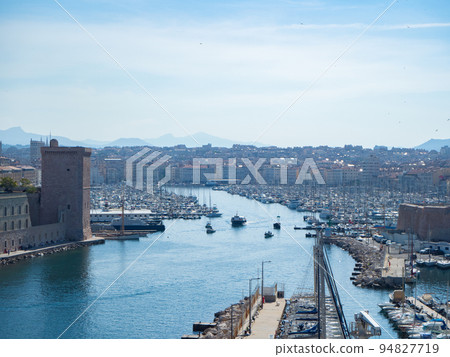Marseille, France - May 15th 2022: Entrance towards the historic harbour Marseille, France - May 15th 2022: Entrance towards the historic harbour 94827719