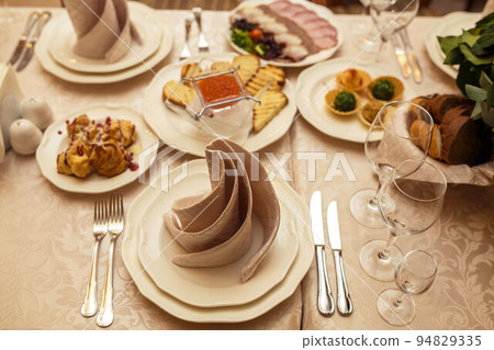 Ceramic tableware on the table 94829335