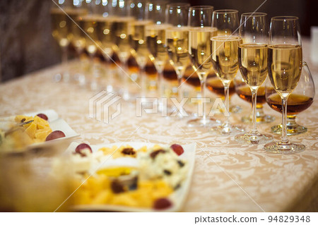 Three glasses of wine on the counter Three glasses of wine on the counter 94829348