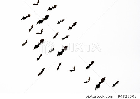 halloween and decoration concept - black 3d paper bats flying over white background. halloween and decoration concept - black 3d paper bats flying over white background. 94829503