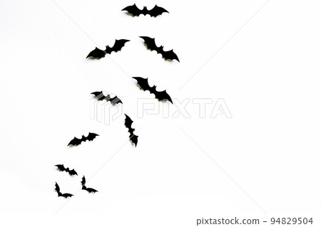 halloween and decoration concept - black 3d paper bats flying over white background. halloween and decoration concept - black 3d paper bats flying over white background. 94829504