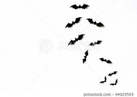 halloween and decoration concept - black 3d paper bats flying over white background. halloween and decoration concept - black 3d paper bats flying over white background. 94829505