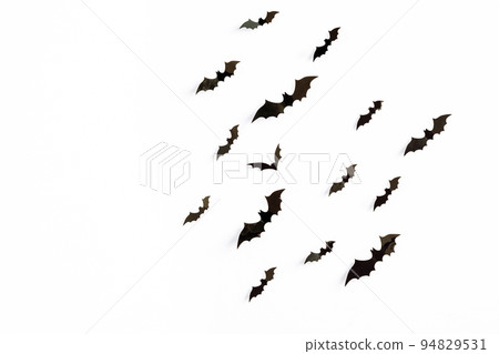 halloween and decoration concept - black 3d paper bats flying over white background. halloween and decoration concept - black 3d paper bats flying over white background. 94829531