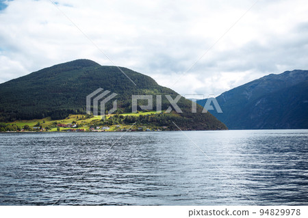 Picturesque Norway mountain village landscape. Amazing nature view with fjord and mountains. 94829978