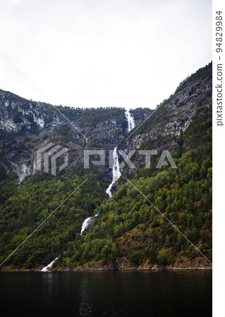 Norway landscape with big waterfall. Picturesque landscape mountains of Norway. Travelling. 94829984