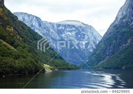 Picturesque landscape mountains of Norway. Beautiful view of the lake. Rocky shore of mountain lake. 94829995