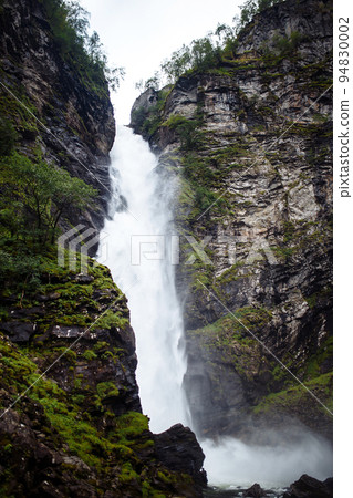 Norway landscape with big waterfall. Picturesque landscape mountains of Norway. Travelling. Norway landscape with big waterfall. Picturesque landscape mountains of Norway. Travelling. 94830002