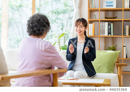 Young business woman selling to senior women Young business woman selling to senior women 94835369