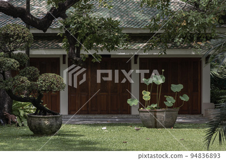 The front of A Thai pavilion architecture with beautifully garden and lotus flowers in ancient pots. 94836893
