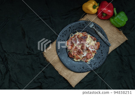 Truffle carbonara spaghetti with fried bacon and grated cheese in ceramic plate. 94838251