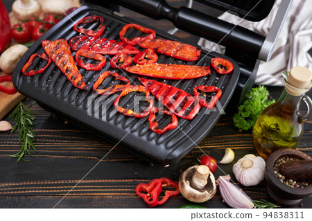 cooking at home on electric grill - red pepper cooking at home on electric grill - red pepper 94838311