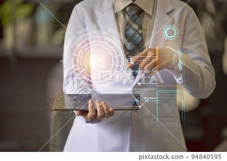 Woman doctor holding smart device with medical holographic Woman doctor holding smart device with medical holographic 94840595