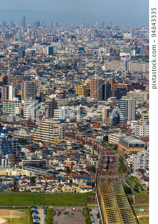 Image of dense office districts and residential areas in the Tokyo metropolitan area 94843335