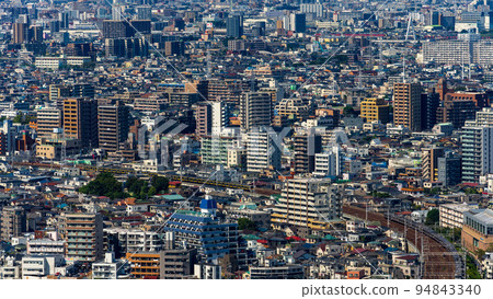 Image of dense office districts and residential areas in the Tokyo metropolitan area 94843340