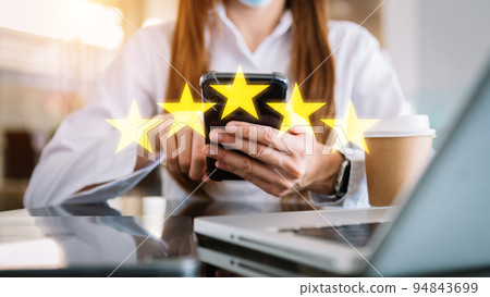 Customer or client the stars to complete five stars. with copy space. giving a five star rating. Service rating, satisfaction concept.. 94843699