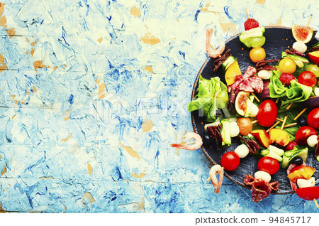 Easy snack from vegetables, fruits, meat and seafood 94845717