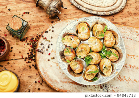Snails baked with sauce Snails baked with sauce 94845718