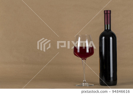 Wine bottle and glass . Space for text. alcoholic drink Wine bottle and glass . Space for text. alcoholic drink 94846616
