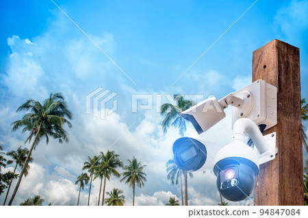Multi-angle CCTV system on wooden poles, background blast cipping path 94847084