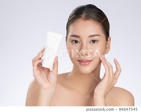 Gorgeous woman smiling holding mockup product for advertising text place. Gorgeous woman smiling holding mockup product for advertising text place. 94847545