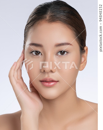 Close up portrait of gorgeous girl posing beauty gesture with clean fresh skin. 94848152