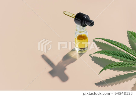 Set of legalized marijuana features with CBD oil product, hemp leaf and bud. 94848153