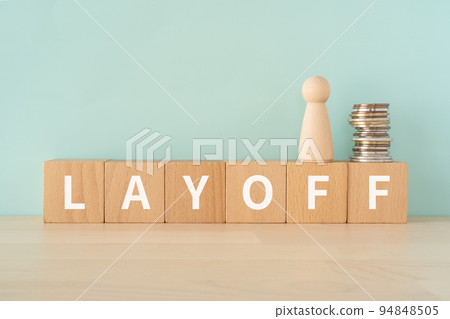 Blocks, coins and money written LAYOFF 94848505