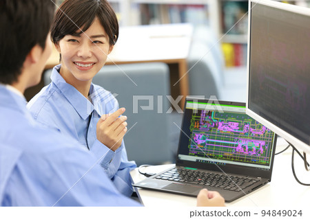 Female designer receiving an explanation of CAD operation_1 94849024