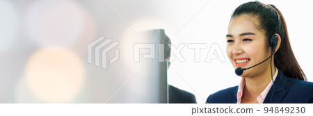 Business people wearing headset working in office in widen view 94849230