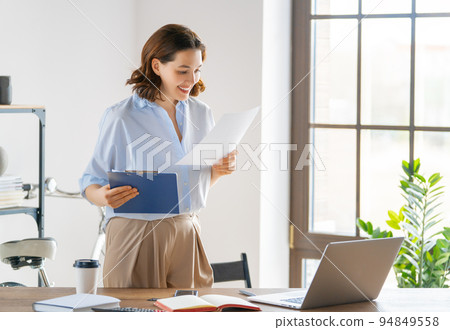 woman working in the office woman working in the office 94849558